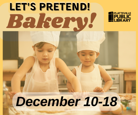 Two kids in chef hats rolling dough in a kitchen.