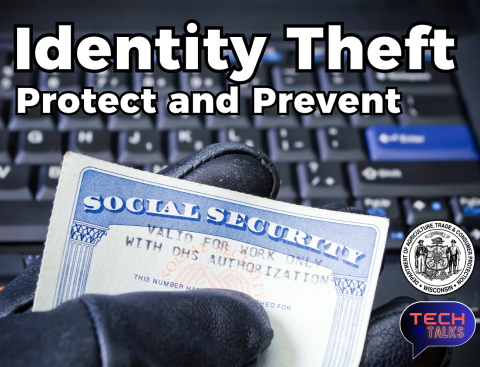 photo of a gloved hand holding a social security card in front of a black computer keyboard